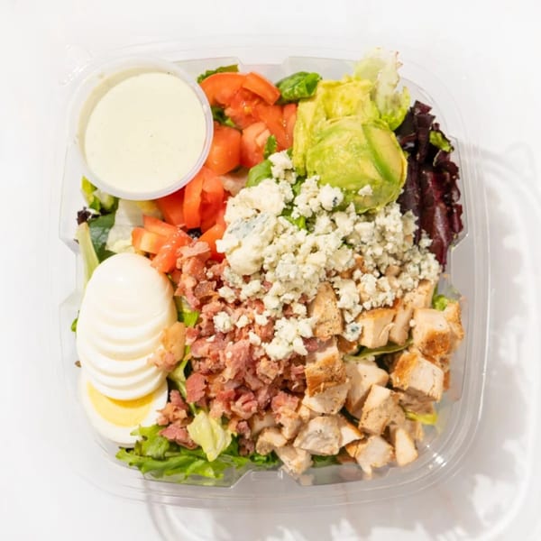 Fresh Millions Cobb salad with chicken, bacon, egg, avocado, tomatoes, and blue cheese.